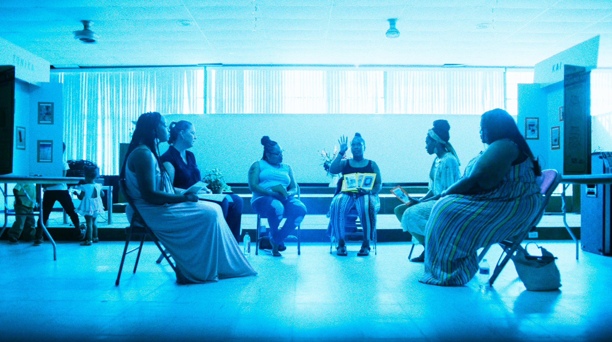 Video still of Whitney Gaskins speaking with mothers in her community