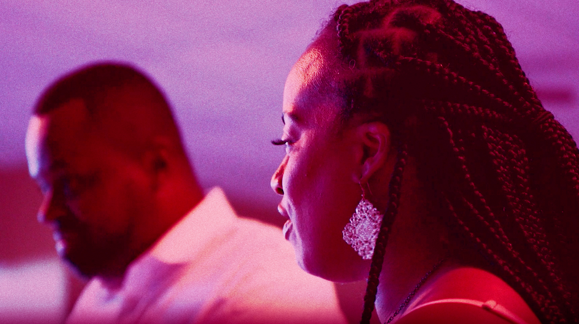 Video still of Whitney Gaskins listening in to a community discussion at one of EPICC’s partner churches