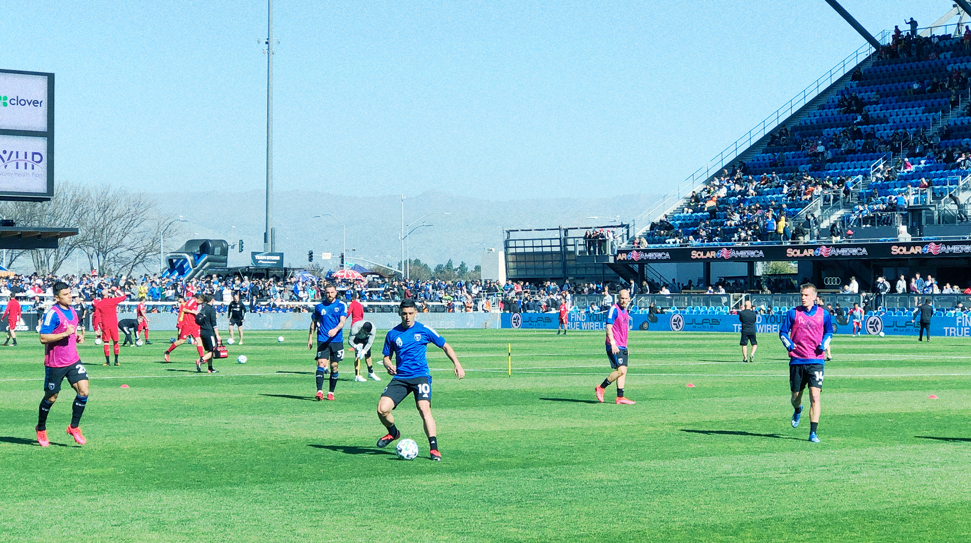 Men playing soccer on green grass field during daytime; San Jose Earthquakes vs Toronto FC